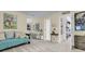 Bright and airy playroom featuring a comfortable seating area, toy kitchen, and ample storage at 8662 W Fairway Woods Dr, North Charleston, SC 29420