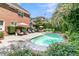 Refreshing pool and manicured yard, complete with patio furniture and lush landscaping at 8662 W Fairway Woods Dr, North Charleston, SC 29420