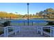 Community tennis court featuring a clean, well-maintained playing surface, surrounded by fencing and mature trees at 8662 W Fairway Woods Dr, North Charleston, SC 29420