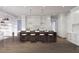 Gourmet kitchen featuring a marble-topped island, counter seating, pendant lighting, and a seamless flow to the living space at 952 Mccants Dr, Mount Pleasant, SC 29464