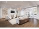 Inviting living room with a cozy fireplace, stylish furnishings, hardwood floors, and French doors for abundant natural light at 952 Mccants Dr, Mount Pleasant, SC 29464