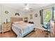 Fun bedroom featuring a bed with wood trim and a game theme, plus wood-look flooring and natural light at 9590 Crosscut Dr, Ladson, SC 29456