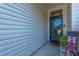 Inviting front entrance with a decorative welcome sign and a charming door at 9590 Crosscut Dr, Ladson, SC 29456