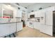 Charming kitchen with white cabinets, stainless steel appliances, and ample counter space at 9590 Crosscut Dr, Ladson, SC 29456