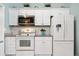 Bright kitchen with white cabinets, stainless steel appliances, and granite countertops at 9590 Crosscut Dr, Ladson, SC 29456