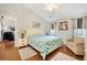 Comfortable main bedroom featuring a ceiling fan, seating area, and natural light at 9590 Crosscut Dr, Ladson, SC 29456