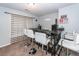Basement bar with bar-height seating, under-counter storage, and decorative wall art at 100 Pine Hall Dr, Goose Creek, SC 29445