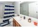 Bathroom with vanity, toilet and shower with striped curtain at 100 Pine Hall Dr, Goose Creek, SC 29445