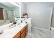 Bathroom with double vanity sink, modern fixtures, gray flooring, and a walk-in shower with glass door at 100 Pine Hall Dr, Goose Creek, SC 29445