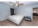 Bedroom with fan, table, and bed with striped comforter at 100 Pine Hall Dr, Goose Creek, SC 29445