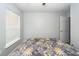 Bedroom with window, door and bed with floral comforter at 100 Pine Hall Dr, Goose Creek, SC 29445