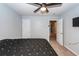 Bedroom with fan, entrance and bed with patterned comforter at 100 Pine Hall Dr, Goose Creek, SC 29445
