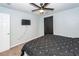 Bedroom featuring TV, door and bed with patterned comforter at 100 Pine Hall Dr, Goose Creek, SC 29445