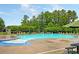 Relax at the community pool, complete with picnic tables, lounge chairs, and lush greenery for a perfect day outdoors at 100 Pine Hall Dr, Goose Creek, SC 29445