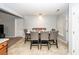 Chic dining room boasts tile floors and a modern light fixture above an elegant dining table at 100 Pine Hall Dr, Goose Creek, SC 29445