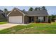 Charming one-story home with a single-car garage, manicured lawn, and inviting curb appeal in a friendly neighborhood at 100 Pine Hall Dr, Goose Creek, SC 29445