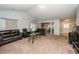 Inviting living room with neutral carpet, open floor plan, and view to other rooms at 100 Pine Hall Dr, Goose Creek, SC 29445