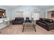 Inviting living room with vaulted ceilings, neutral tones, and comfortable leather seating at 100 Pine Hall Dr, Goose Creek, SC 29445