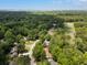 Aerial view of a neighborhood with lush trees and a golf course in the distance at 1019 Royalist Rd, Mount Pleasant, SC 29464