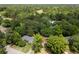 Aerial view of a property nestled among lush trees, with a golf course visible nearby at 1019 Royalist Rd, Mount Pleasant, SC 29464