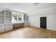 Bright bedroom with a built-in desk, shelving and drawers, and hardwood floors at 1019 Royalist Rd, Mount Pleasant, SC 29464
