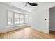 Bright bedroom featuring a bay window with wooden shutters and hardwood flooring at 1019 Royalist Rd, Mount Pleasant, SC 29464