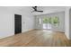 Spacious bedroom featuring wooden floors, a dark colored door, a ceiling fan and access to a private deck at 1019 Royalist Rd, Mount Pleasant, SC 29464