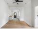 An additional view of a bonus room featuring hardwood floors, a wet bar, and ample natural light at 1019 Royalist Rd, Mount Pleasant, SC 29464