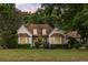 Charming home featuring a well-manicured lawn and mature trees, providing a welcoming curb appeal at 1019 Royalist Rd, Mount Pleasant, SC 29464