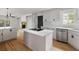 Bright modern kitchen featuring an island cooktop, stainless appliances and wooden flooring at 1019 Royalist Rd, Mount Pleasant, SC 29464