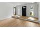 Bright and airy living room with hardwood floors, fresh white paint, and natural light from multiple windows at 1019 Royalist Rd, Mount Pleasant, SC 29464