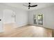 Open living space showcasing hardwood floors, modern lighting, and access to the outdoor patio at 1019 Royalist Rd, Mount Pleasant, SC 29464