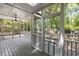 Spacious screened-in porch with ceiling fan and views of backyard at 1019 Royalist Rd, Mount Pleasant, SC 29464