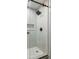 Contemporary shower with sleek glass enclosure, rainfall showerhead, and mosaic tile floor at 1019 Royalist Rd, Mount Pleasant, SC 29464