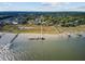 Expansive aerial view of waterfront homes featuring private docks extending into the serene waterway at 104 Wando Reach Rd, Wando, SC 29492