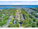An aerial view of a charming neighborhood with tree-lined streets, close to a scenic waterway and recreational boating at 104 Wando Reach Rd, Wando, SC 29492