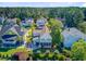 Inviting backyard featuring a comfortable screened porch, patio with a fire pit, and beautifully manicured landscaping at 104 Wando Reach Rd, Wando, SC 29492