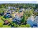 Attractive home boasting a private backyard, lush landscaping, a screened porch, and comfortable patio seating at 104 Wando Reach Rd, Wando, SC 29492