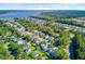 An aerial view of a tree-filled neighborhood featuring unique homes and access to waterfront living with a community pool at 104 Wando Reach Rd, Wando, SC 29492