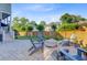 Spacious backyard with stone patio, outdoor seating, and wooden fence is perfect for entertaining at 104 Wando Reach Rd, Wando, SC 29492