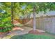 Backyard featuring a hammock between trees and wooden fence at 104 Wando Reach Rd, Wando, SC 29492
