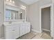 Bright bathroom with double vanity, large mirror, and tiled floors at 104 Wando Reach Rd, Wando, SC 29492