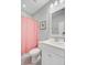 Bathroom featuring a white vanity, toilet, and a pink shower curtain at 104 Wando Reach Rd, Wando, SC 29492
