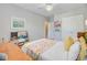 Bedroom featuring a bed with floral bedding and a play kitchen set at 104 Wando Reach Rd, Wando, SC 29492