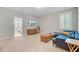 Comfortable bonus room with a couch, TV, and a view into the bedroom at 104 Wando Reach Rd, Wando, SC 29492