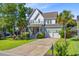 Charming two-story home with a well-manicured lawn and a convenient two-car garage at 104 Wando Reach Rd, Wando, SC 29492