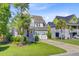 Charming two-story home with a well-manicured lawn and a convenient two-car garage at 104 Wando Reach Rd, Wando, SC 29492