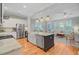 Open concept kitchen features an island with granite countertops and stainless steel appliances at 104 Wando Reach Rd, Wando, SC 29492