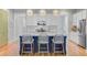 Open concept kitchen featuring an island with seating, granite countertops and stainless steel appliances at 104 Wando Reach Rd, Wando, SC 29492
