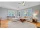 Spacious living room with large windows, hardwood floors and a comfortable sofa at 104 Wando Reach Rd, Wando, SC 29492